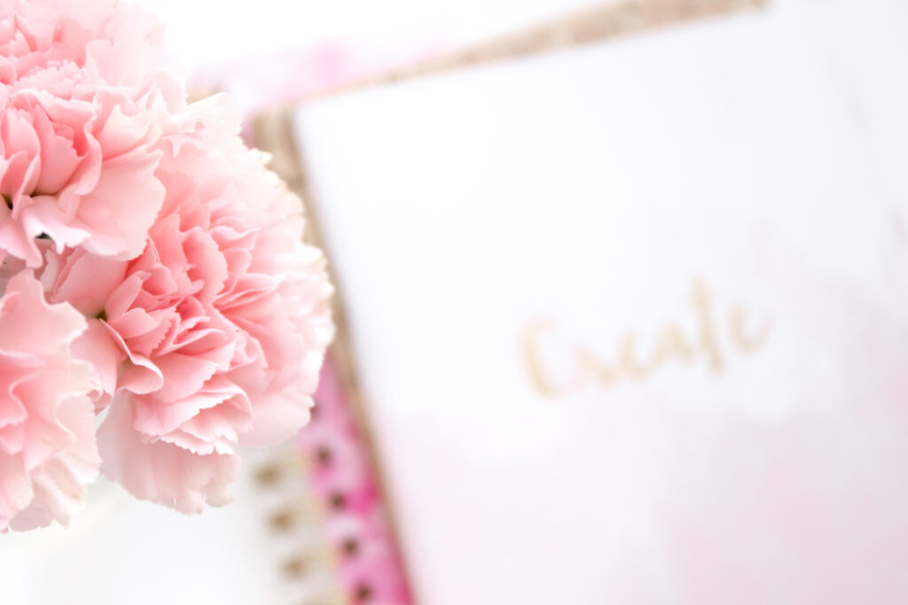 Flowers, and notebook with 'create' written on it 